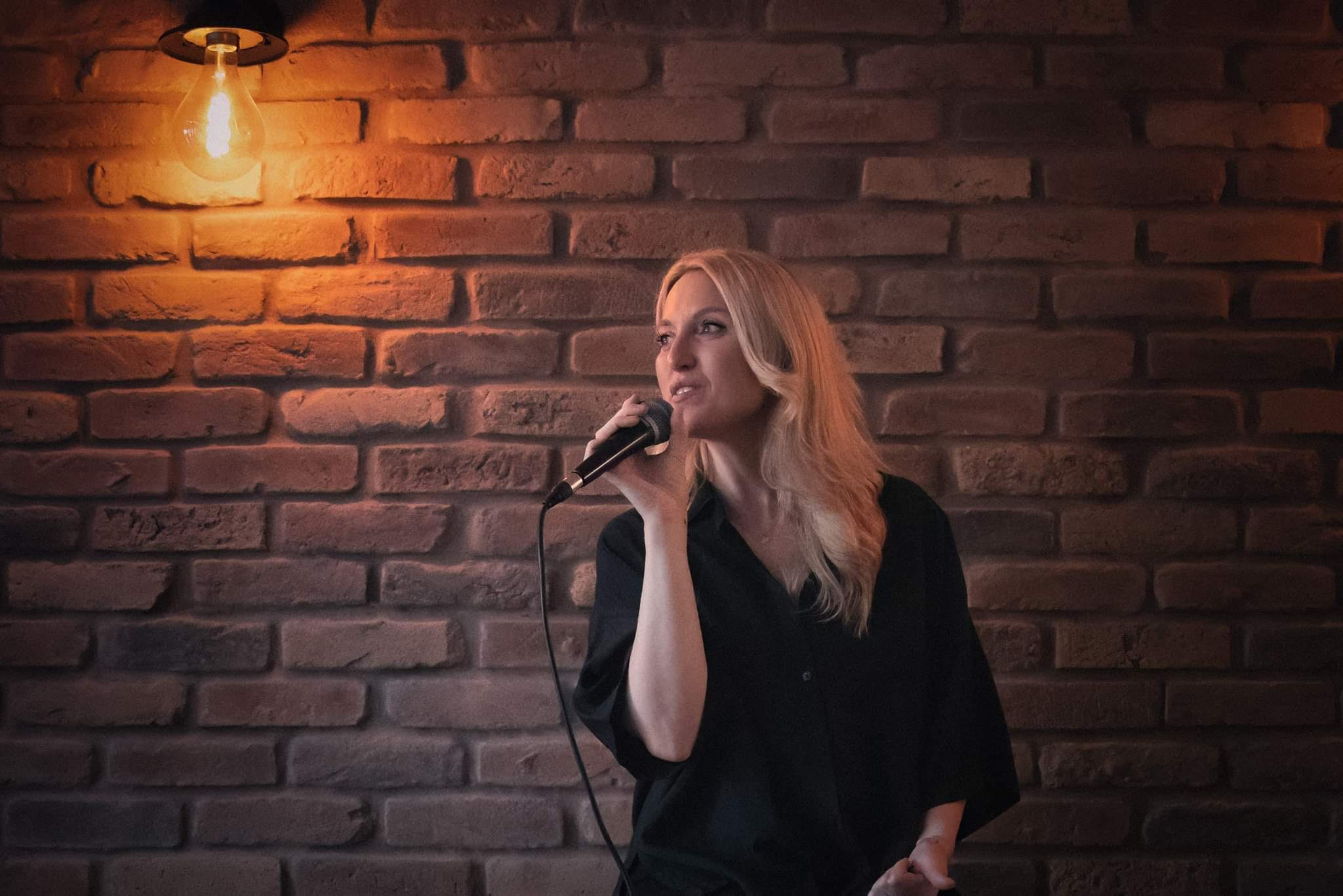 Eliza singing with mic